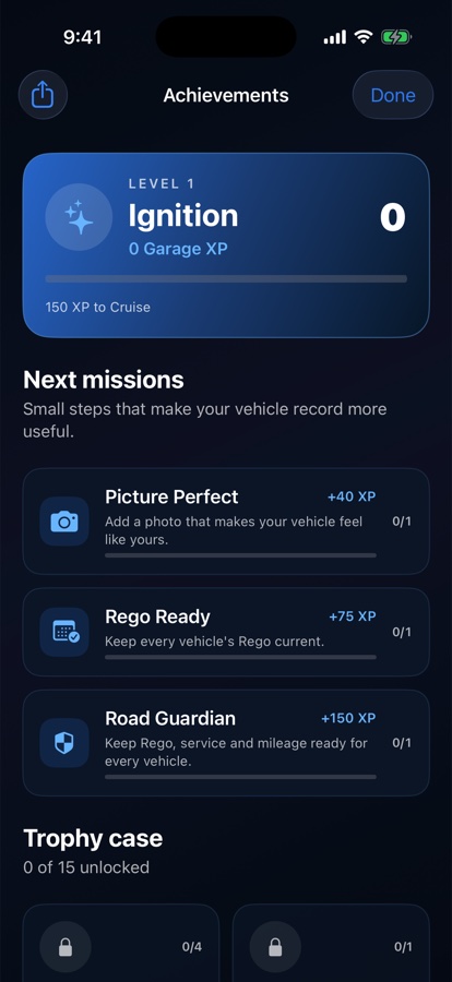 Drilore Achievements screen with record-completeness missions for a vehicle photo, current Rego and complete road records